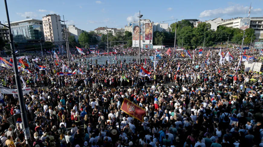 Tens of thousands rally in Serbia's capital to demand snap elections