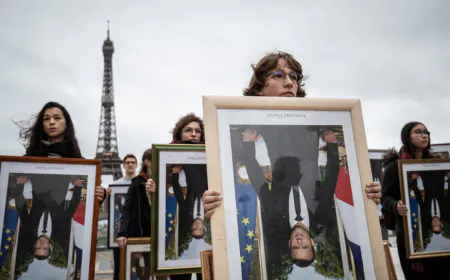EU court says France can fine climate activists who stole portraits of Macron
