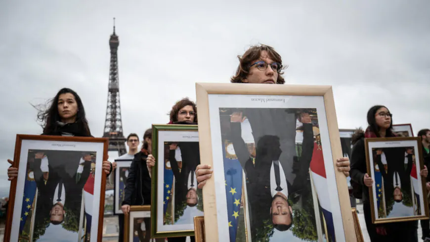 EU court says France can fine climate activists who stole portraits of Macron