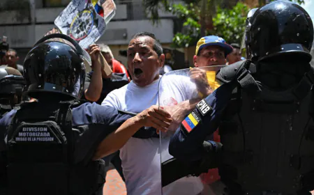 Venezuela police tear gas protesters calling for pay and pension rises