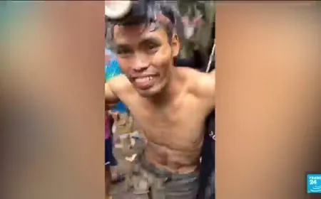 Rescuers pull four villagers trapped in a flooded cave during ten days